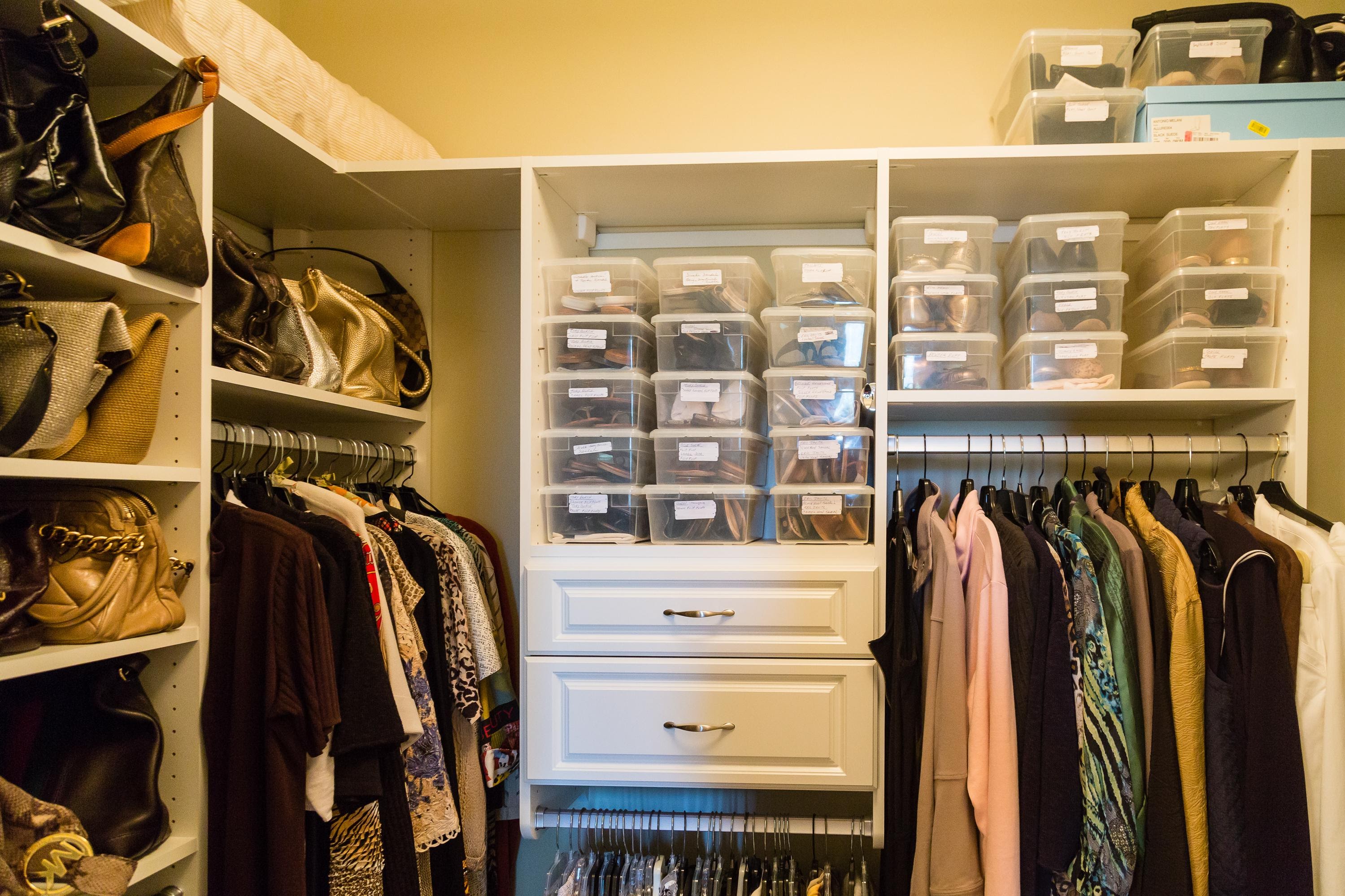 Organized wardrobe with labeled boxes